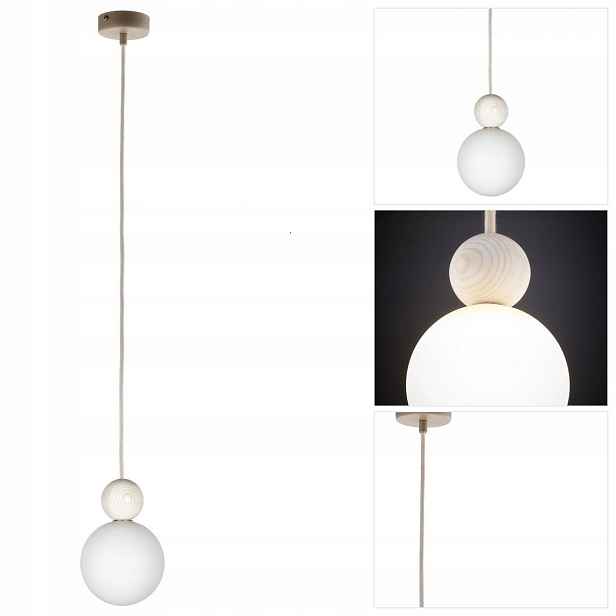 Závěsná béžová lampa Rona je moderní vedle křesla v čítárně Sigma Lighting