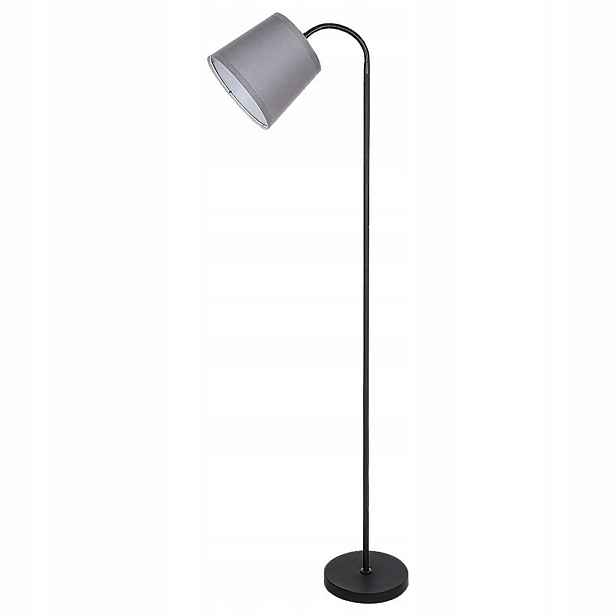 Černá podlahová lampa Godric s teplým leskem vedle křesla Rabalux